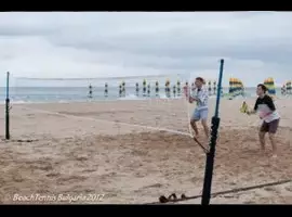 A man is playing frisbee on the beach