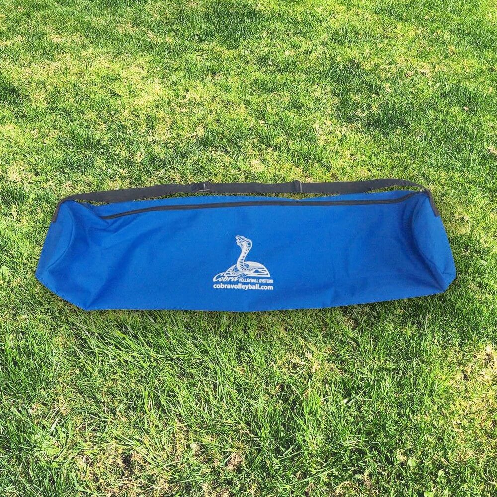A blue bag sitting on top of grass.