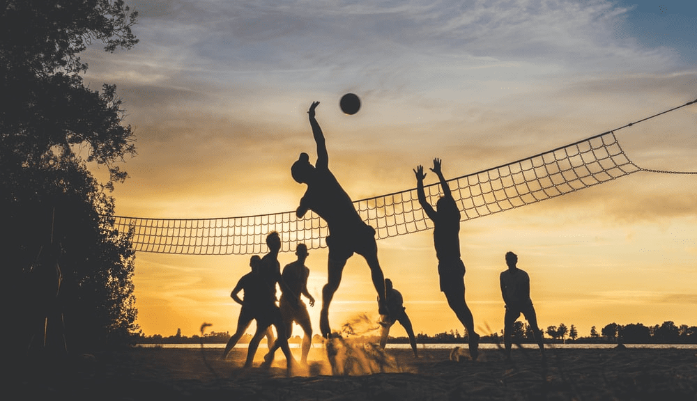 People playing outdoor volleyball.